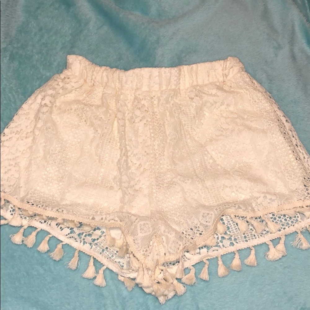 Lush lace crocheted shorts with tassels at end.